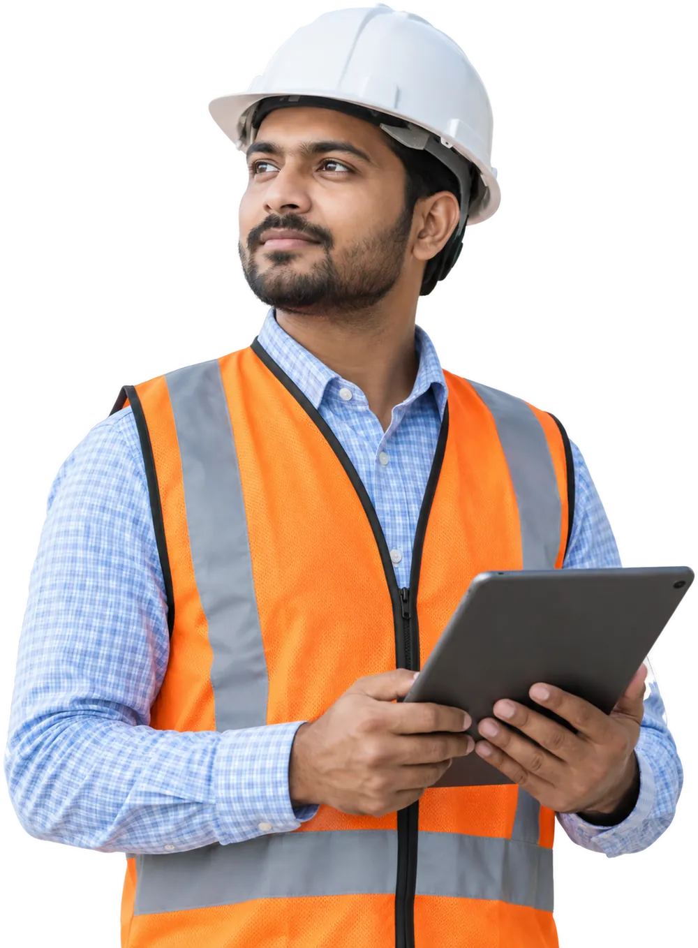 Site engineer in a hard hat and safety vest checking project progress on a tablet
